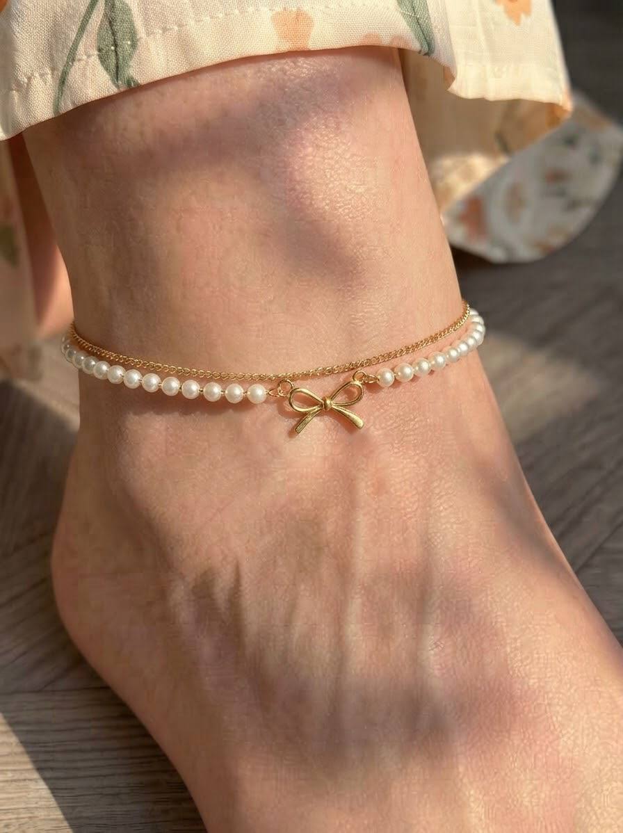 Pearl Bow Layered Anklet, golden chain with pearl-style beads and a bow charm